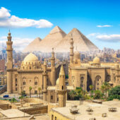 View of the Mosque Sultan Hassan in Cairo and pyramids